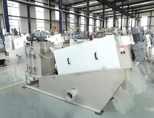 Sludge dewatering press on a stainless steel skid with drive, wash water and control equipment